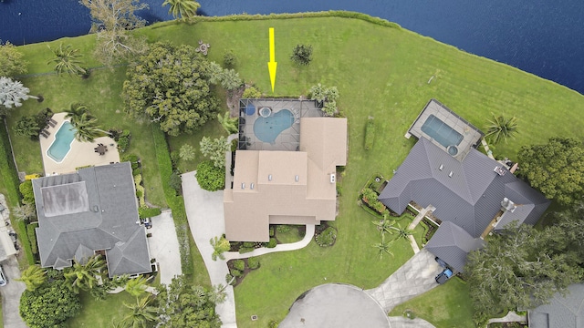 birds eye view of property with a water view