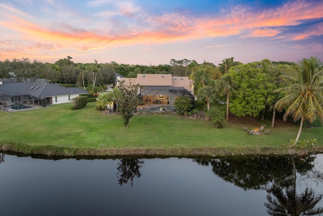 aerial view at dusk with a water view