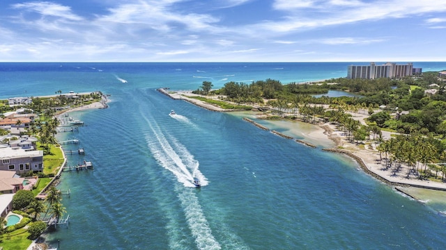 drone / aerial view featuring a water view and a beach view