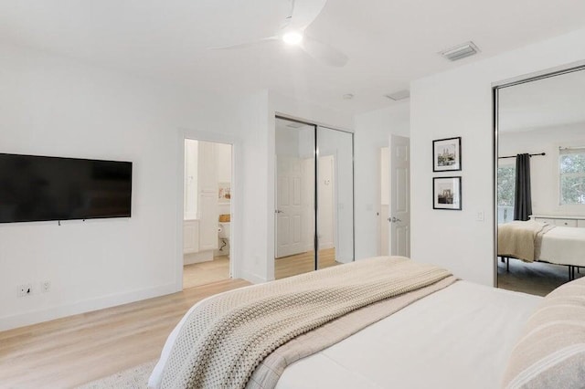 bedroom featuring ensuite bathroom, light hardwood / wood-style floors, and ceiling fan