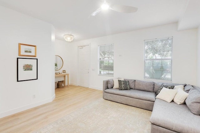 living room with hardwood / wood-style flooring and ceiling fan