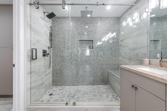 bathroom featuring vanity and an enclosed shower