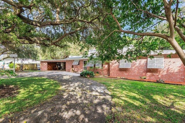 ranch-style home with a front lawn