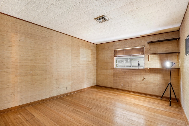 spare room with light wood-type flooring