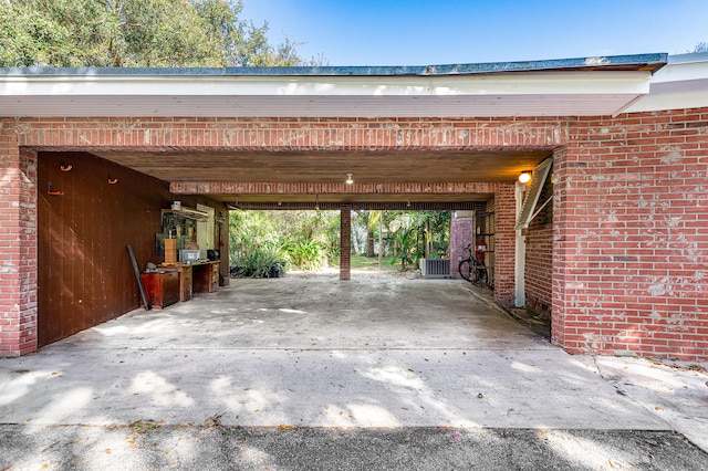 garage with cooling unit and a carport