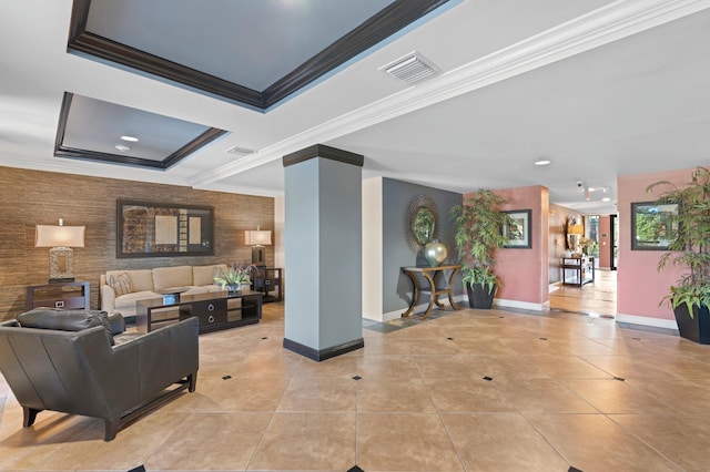 living room with decorative columns, light tile patterned floors, and crown molding