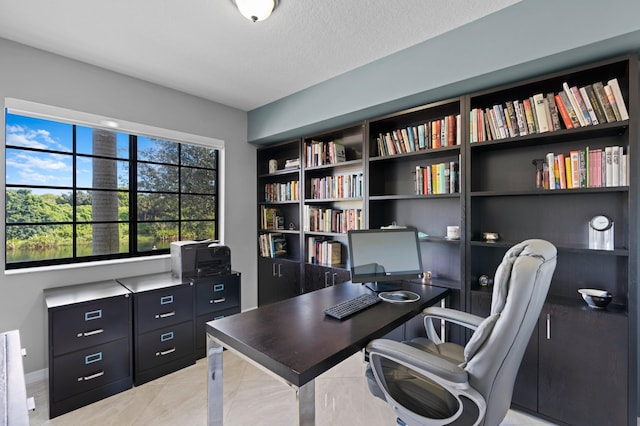 office area featuring a textured ceiling