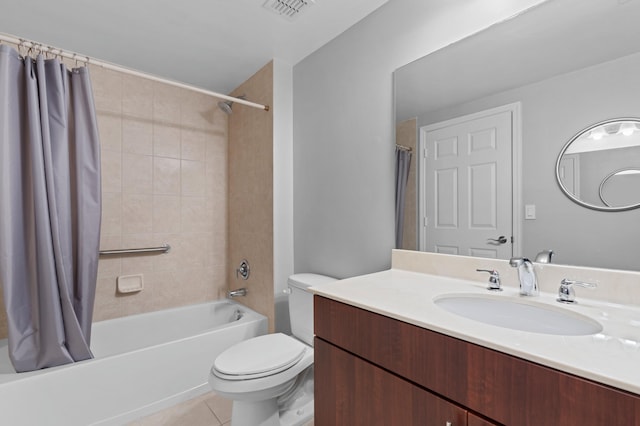 full bathroom featuring toilet, shower / bath combo, vanity, and tile patterned flooring