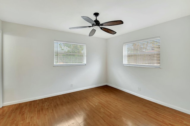 spare room featuring ceiling fan and wood-type flooring