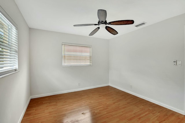 unfurnished room featuring hardwood / wood-style flooring and ceiling fan