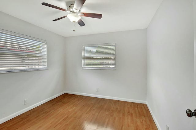 empty room featuring ceiling fan and light hardwood / wood-style flooring