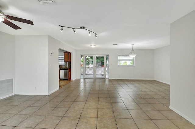 tiled empty room with ceiling fan