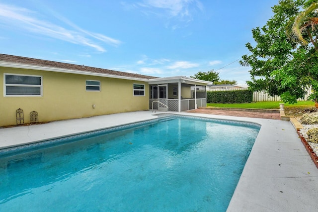 view of pool with a sunroom