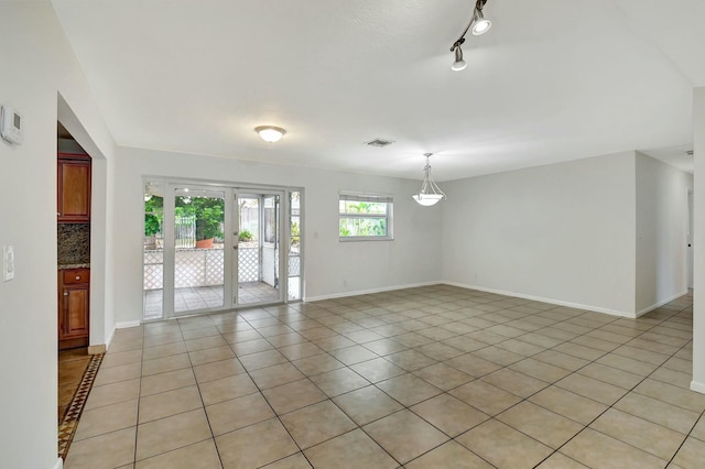 view of tiled spare room