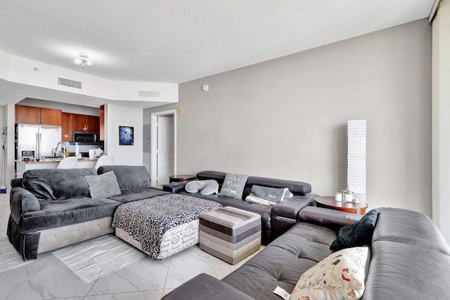 living room with a textured ceiling