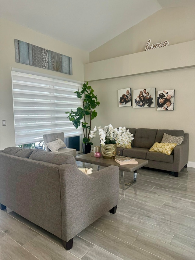 living room with lofted ceiling