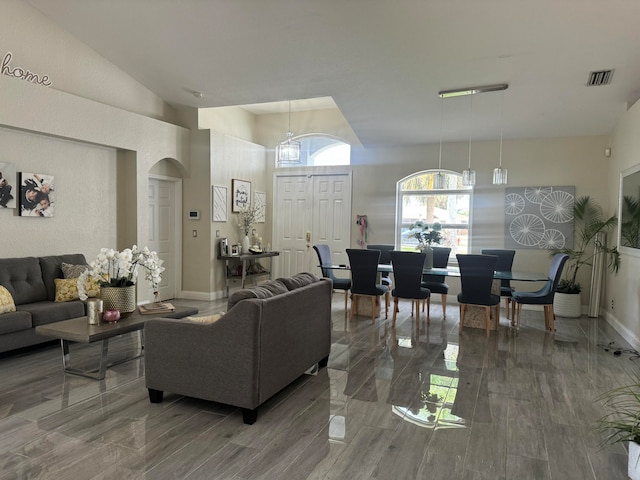 living room with a high ceiling