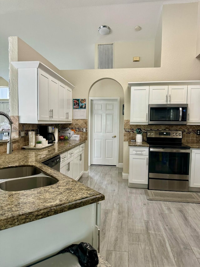 kitchen featuring white cabinets and appliances with stainless steel finishes