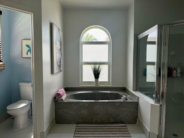 bathroom with plus walk in shower, tile patterned floors, and toilet