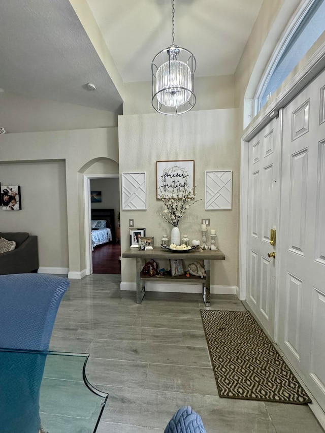 entrance foyer featuring a chandelier