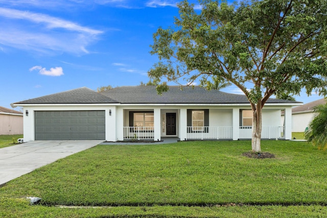 ranch-style home with covered porch, a garage, and a front yard