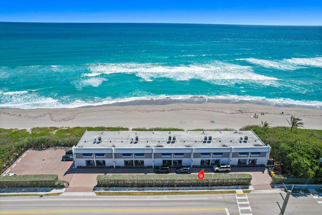 aerial view featuring a water view and a beach view