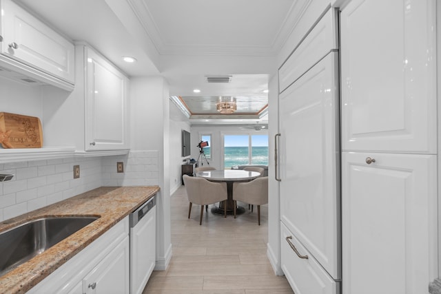 kitchen featuring sink, dishwasher, white cabinets, light stone counters, and ornamental molding