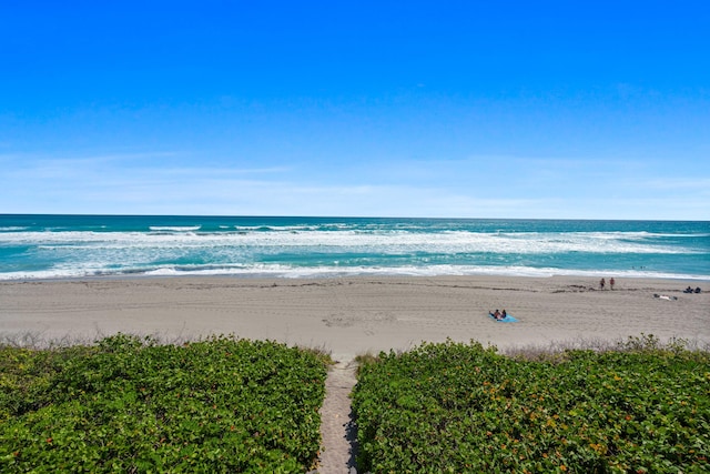 view of water feature with a beach view