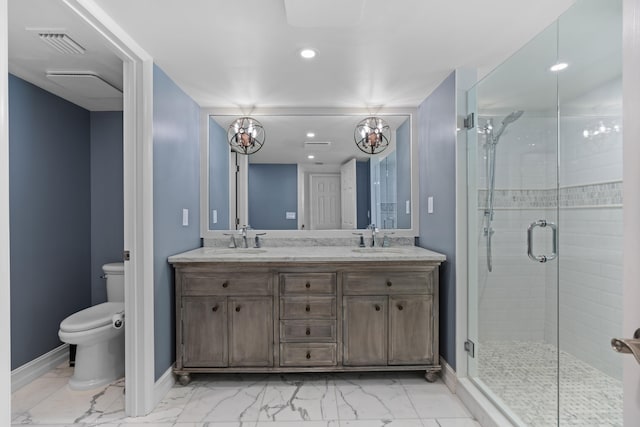 bathroom with a shower with door, vanity, and toilet