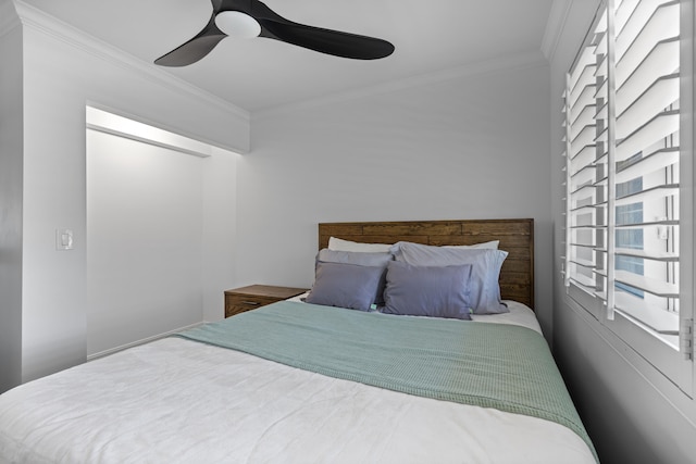 bedroom with crown molding and ceiling fan