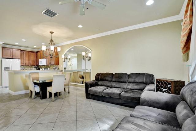 living room featuring crown molding, light tile patterned floors, and ceiling fan with notable chandelier