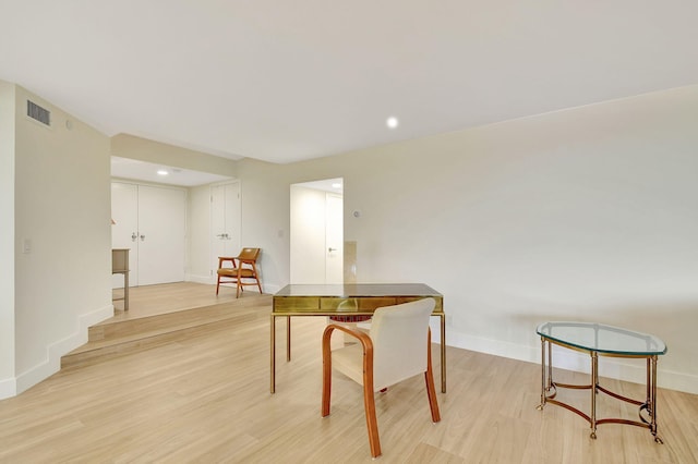 dining space with light hardwood / wood-style flooring