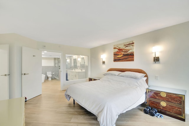 bedroom with light wood-type flooring