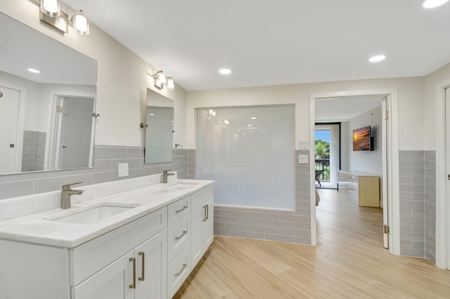 bathroom featuring vanity and hardwood / wood-style floors