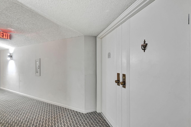 interior space featuring a textured ceiling