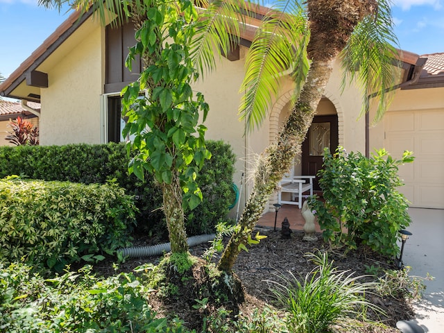 view of side of home featuring a garage