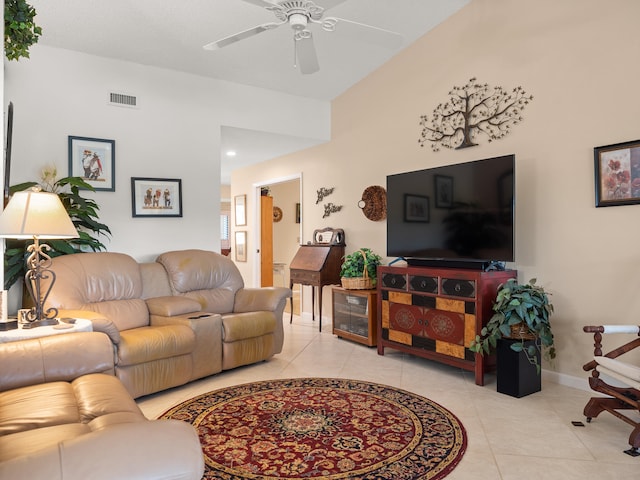 living room featuring light tile patterned floors and ceiling fan