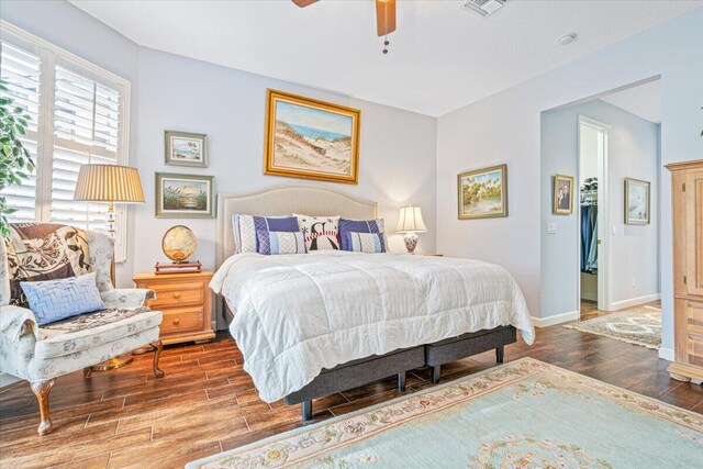 bedroom with ceiling fan and hardwood / wood-style floors