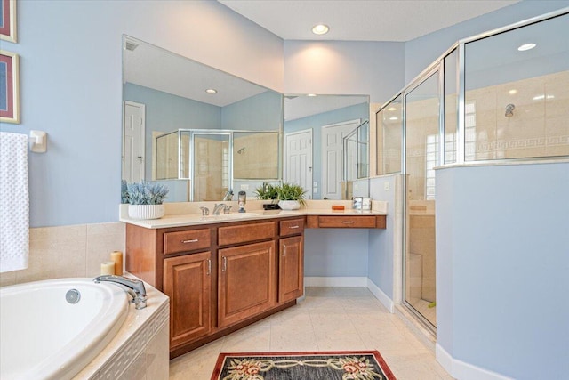 bathroom featuring vanity, plus walk in shower, and tile patterned flooring