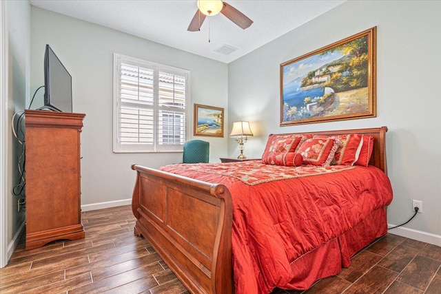 bedroom featuring ceiling fan and dark hardwood / wood-style flooring