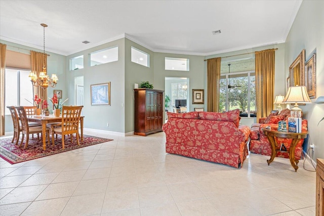 living room featuring crown molding, a notable chandelier, and light tile patterned floors