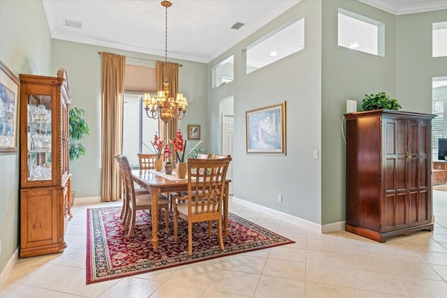 tiled dining room featuring ornamental molding, a chandelier, and a high ceiling