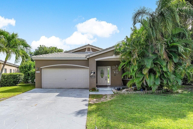 view of front of house featuring a front yard and a garage