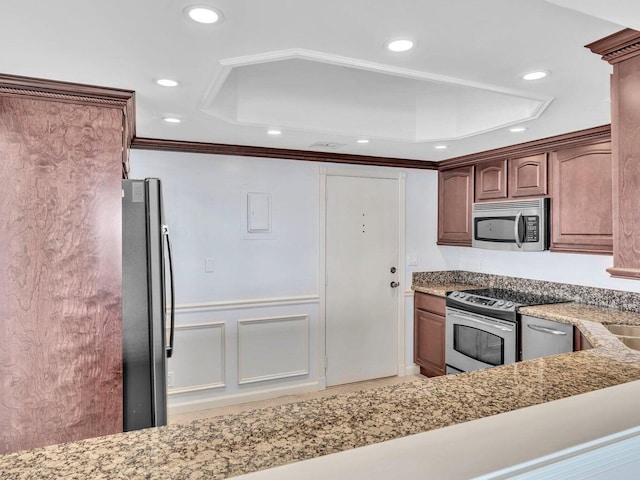 kitchen featuring crown molding and appliances with stainless steel finishes