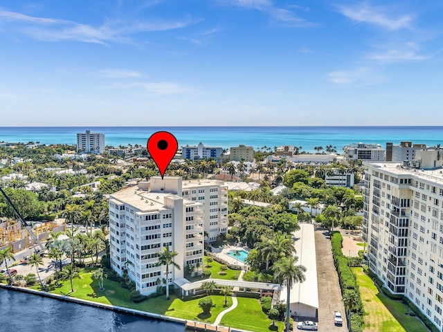 birds eye view of property with a water view