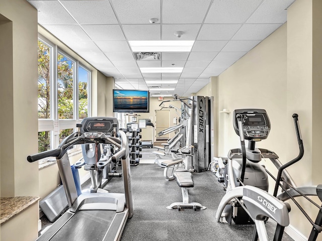 gym featuring a paneled ceiling