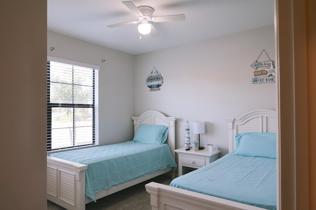 carpeted bedroom with ceiling fan