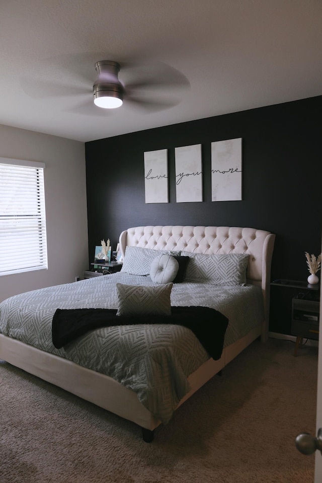 bedroom featuring carpet flooring and ceiling fan