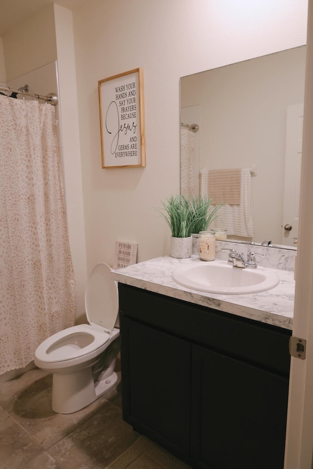 bathroom with vanity, a shower with curtain, toilet, and tile patterned floors