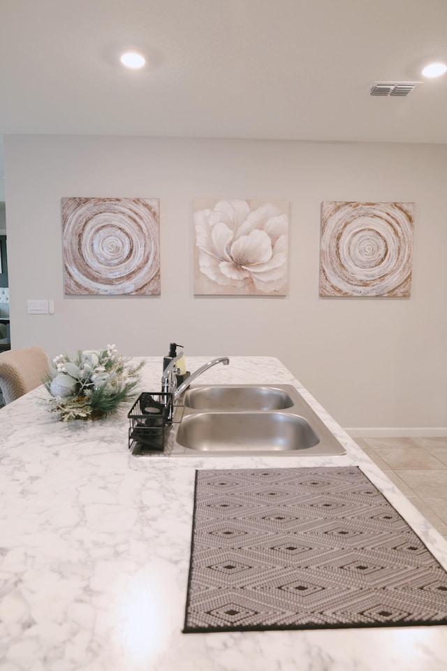 interior details featuring sink and tile patterned flooring